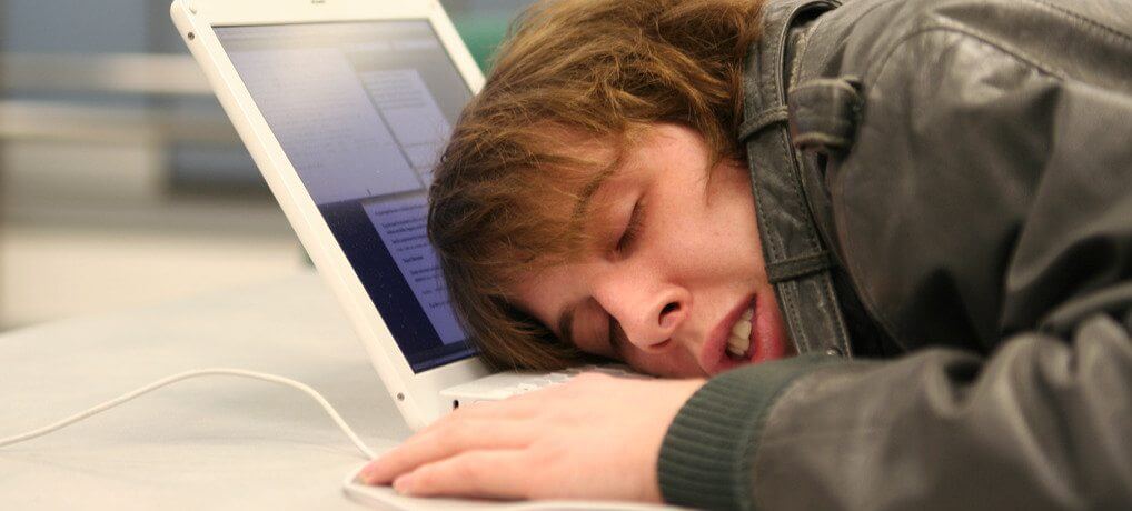 disengaged employee naps at desk